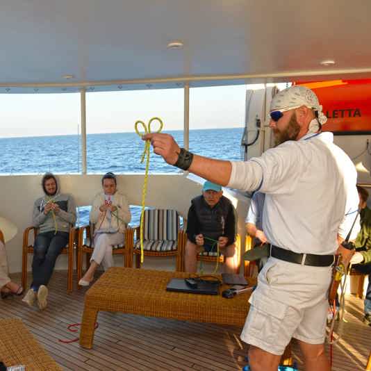 How can knots tying be an entertainment onboard a cruise ship?